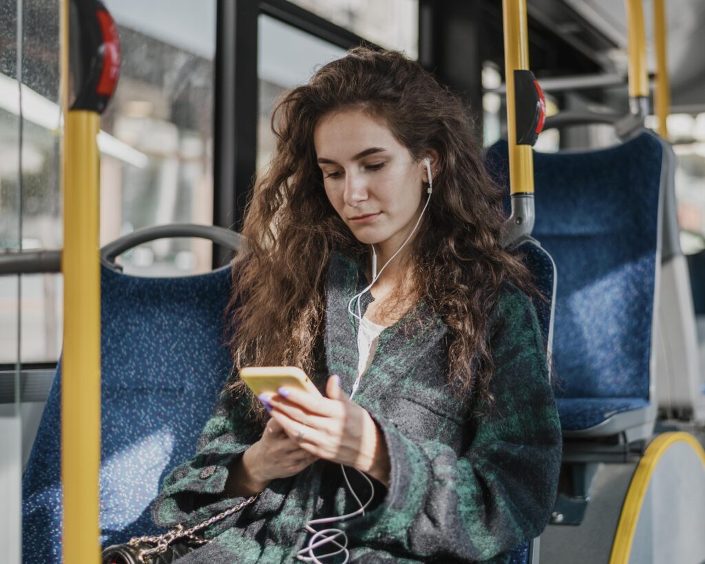 travelling-with-bus-listening-music
